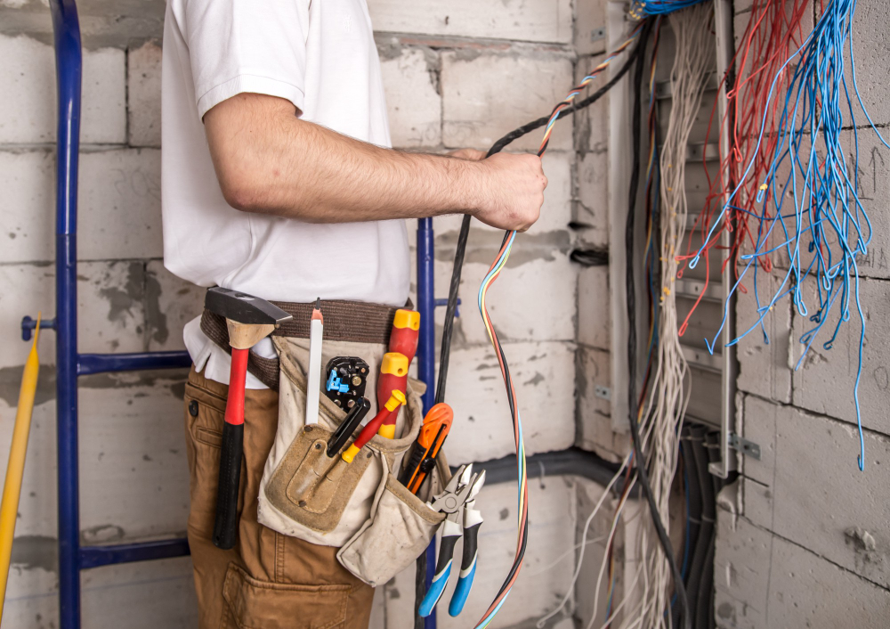 Licensed solar electrician in Sydney inspecting solar system wiring and connections