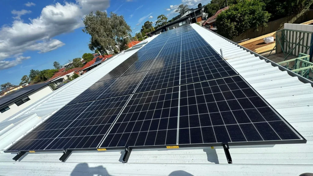 Solar electrician Sydney inspecting rooftop panels for low power output