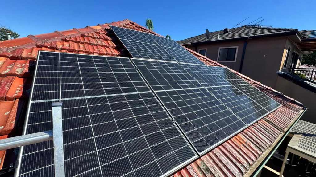 Solar panels installed on a roof in Sydney by Charlie Sparks.